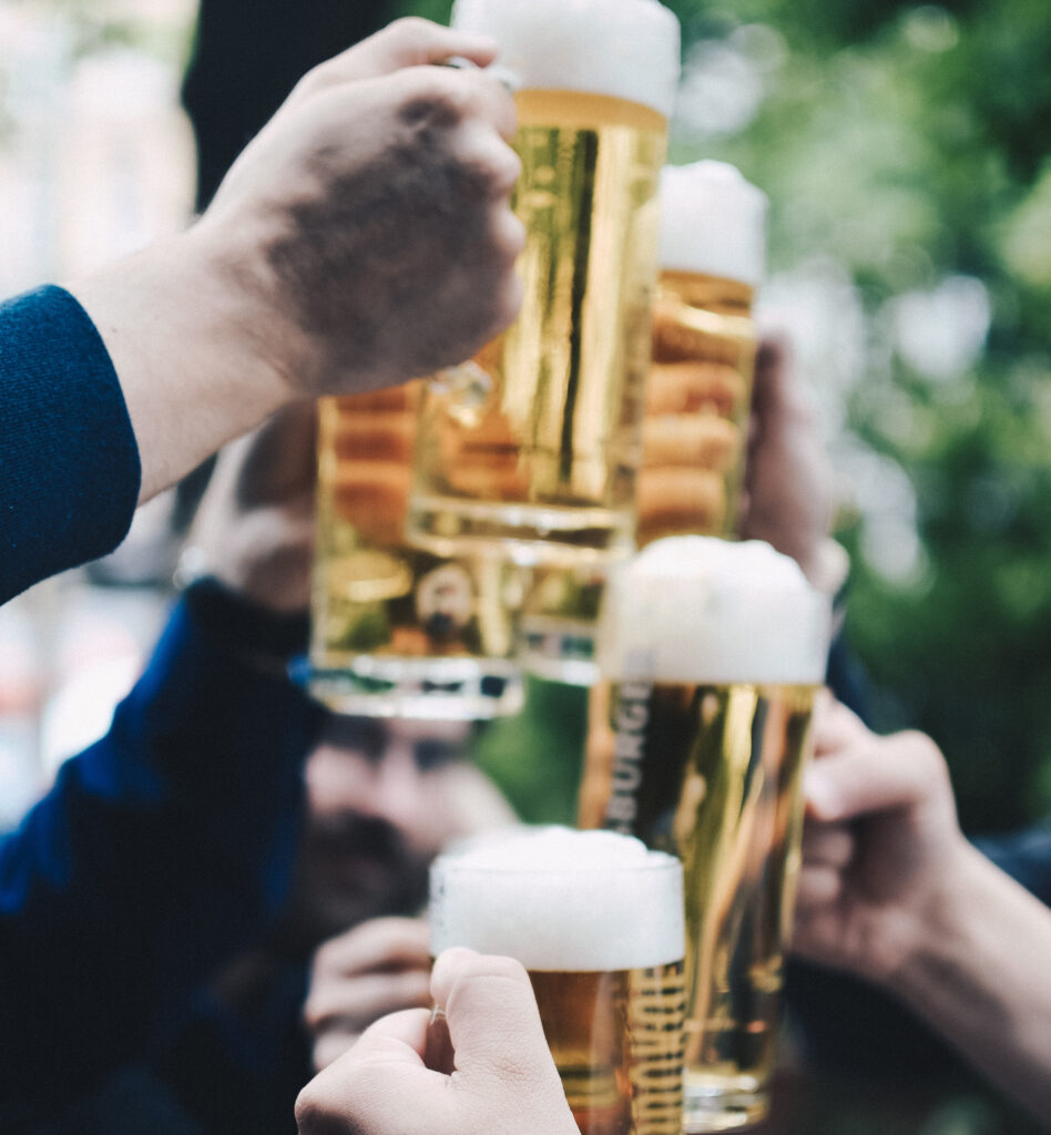 Hands raised with steins